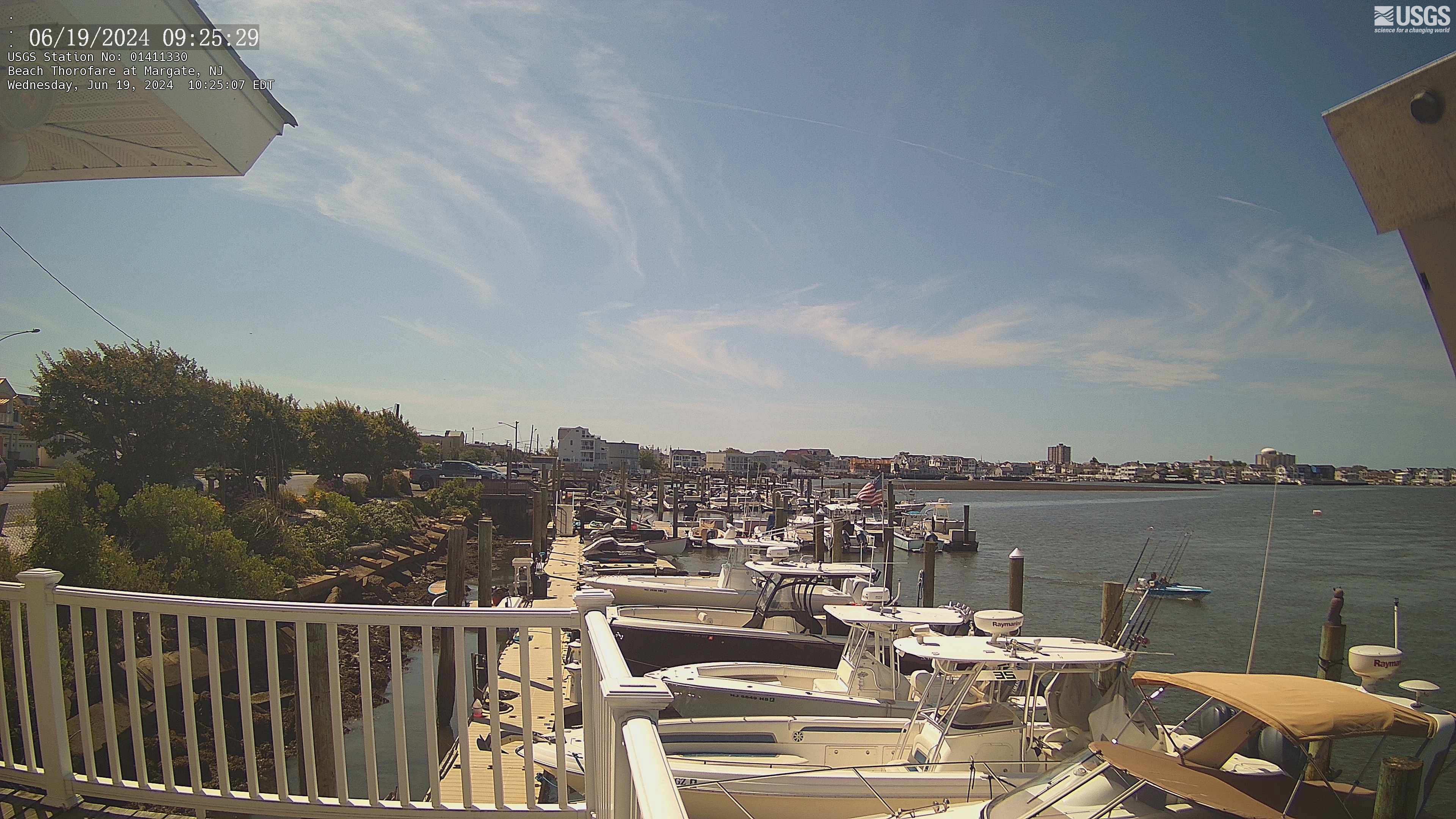 Looking out over a marina of boats towards the open bay